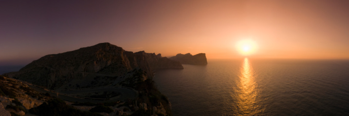 Beautiful sunset over the protected peninsular of Formentor in Majorca. Stitched panorama detailed when viewed large.