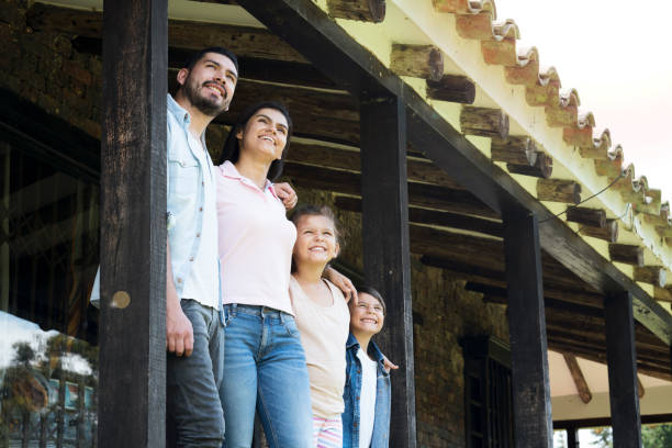 istock Happy family embraced looking at the sky 1056917570