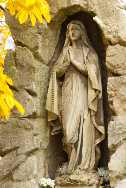 istock Virgin Mary statue at cemetery 1056917688
