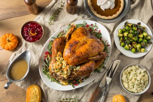 Whole Roasted Turkey Dinner For Thanksgiving Whole Roasted Turkey Dinner For Thanksgiving with All the Sides stuffed stock pictures, royalty-free photos & images