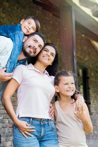 istock Happy family embraced looking at the sky 1056918212