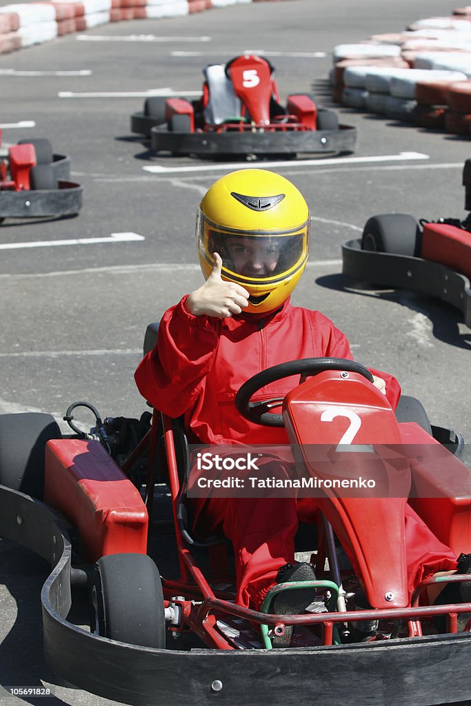 smiling young  racer A smiling young  racer shows ok. Go-carting Go-Carting Stock Photo