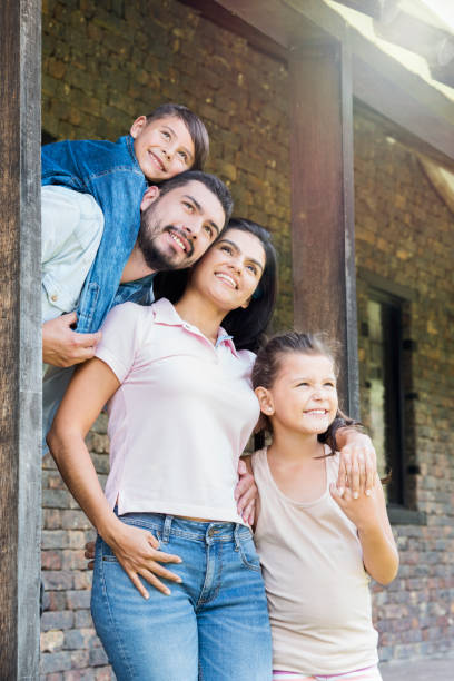 istock Happy family embraced looking at the sky 1056918296