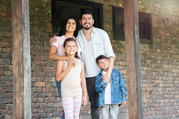 istock Happy family embraced looking at the sky 1056918392