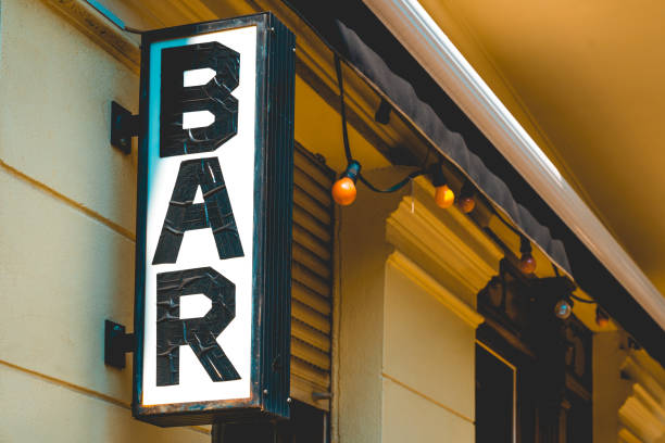istock hand taped bar sign on yellow building 1056923678