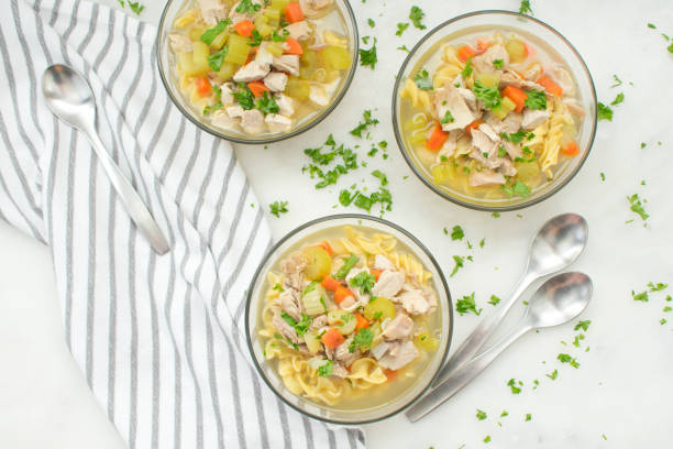 istock Bowls of Chicken Noodle Soup with Vegetables 1056923928