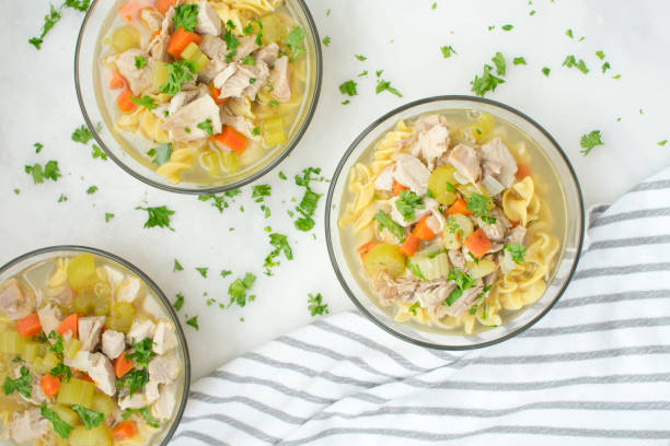 istock Bowls of Chicken Noodle Soup with Vegetables 1056923954