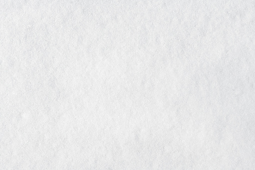 Closeup of snow for winter or Christmas background. Top view.