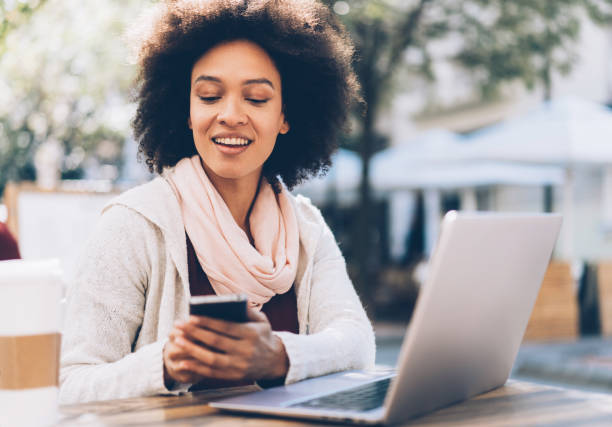 istock Woman working with laptop and smartphone 1056925774