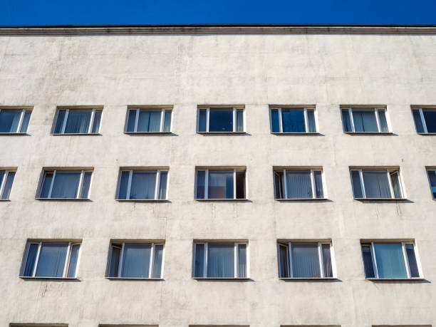 istock front view of white urban building in sunny day 1056926144