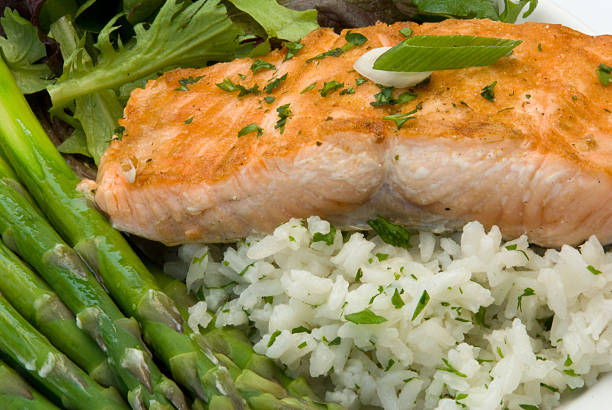 istock Salmon, Rice Pilaf, and Asparagus Gourmet Dinner 105693373
