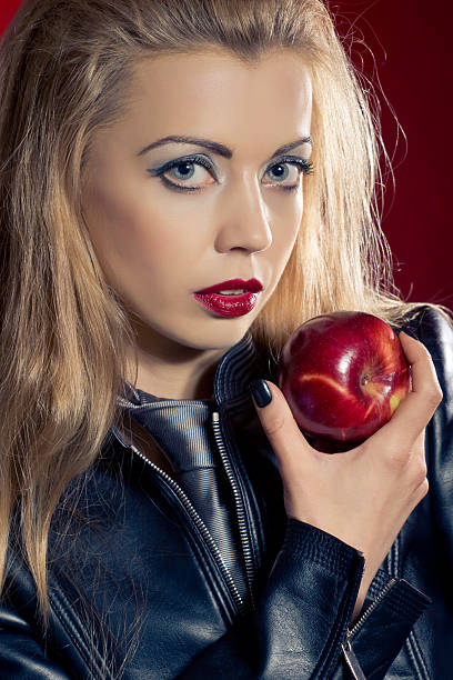 istock Sensual blond woman with an apple 105694512