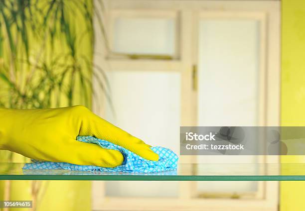 Hand In Yellow Gloves Doing Spring Cleaning Stock Photo - Download Image Now - Duster, Blue, Cleaning