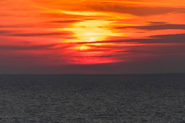 istock The sun sets over the horizon 1056949258