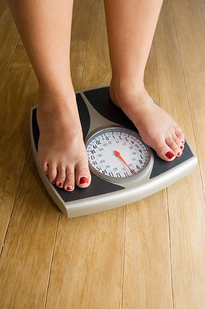 istock Feet on Weighing Scales 105695637