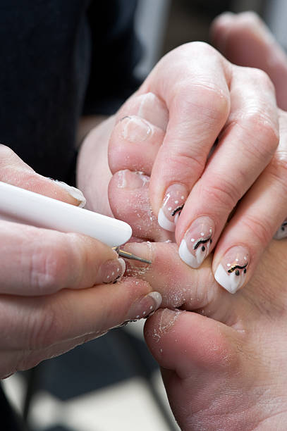 Foot therapist working on a mans feet stock photo