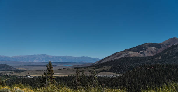 istock endless landscape mountain and meadow with lake 1056962260