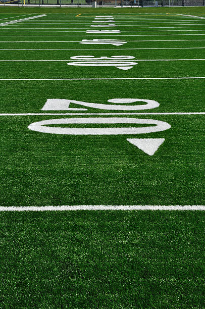 Close-up of the 20 yard line at an American Football Field stock photo