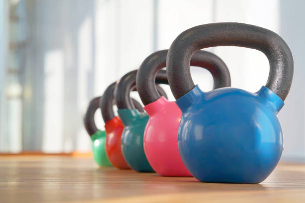 istock Colorful kettlebells in gym 1056964140