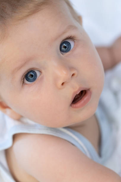 istock Curious serene little baby staring at the camera 1056966358