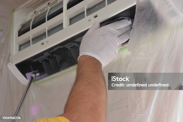 Cleaning Work Of Air Conditioner Stock Photo - Download Image Now - Adult, Air Conditioner, Apartment