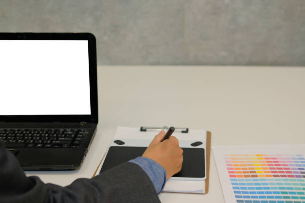 istock interior designer drawing on graphic tablet at office. artist working with computer at workplace. photographer retouch photo. design creativity concept 1056971548