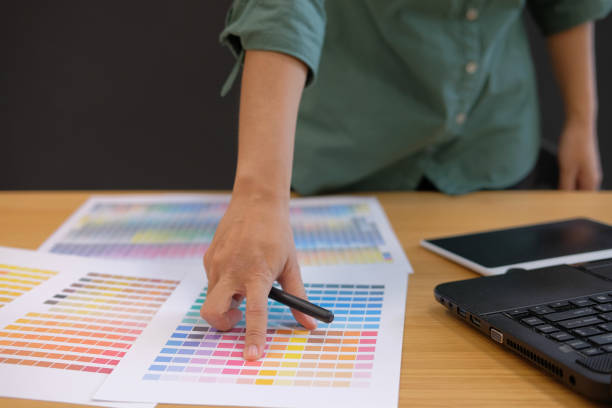 istock graphic interior designer choosing color from swatch sample catalogue palette guide 1056971992