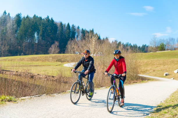 istock Couple Cycling Through Countryside Together 1056974616