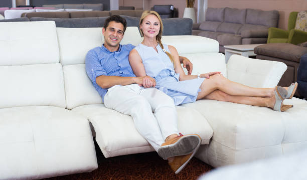 istock Happy Family are choosing sofa together 1056974846
