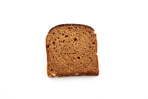 Slice of brown bread stock photo