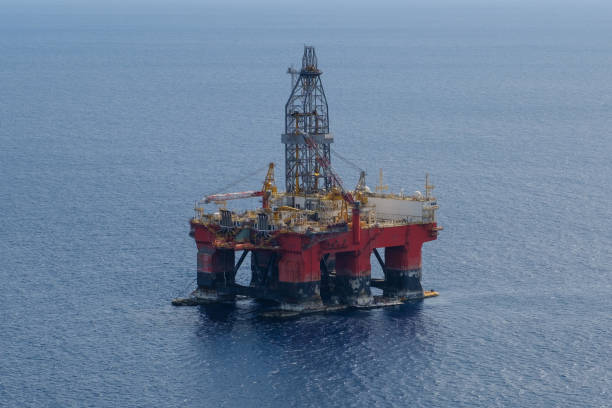 istock offshore drill platform -aerial, drilling platfom / oil rig 1056977730