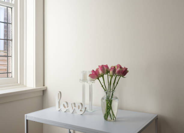 istock Flowers In Vase With Text On Table At Home 1056980674