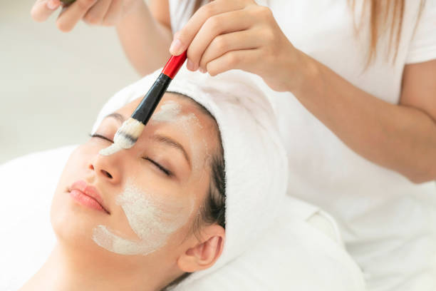 istock Beautiful woman relaxing in day spa. 1056983802