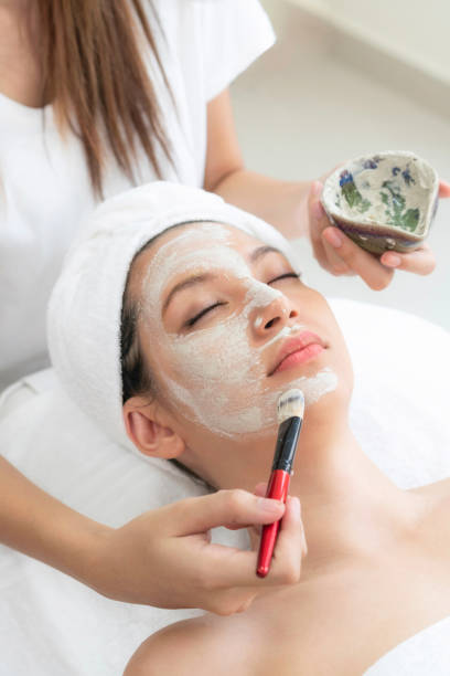istock Beautiful woman relaxing in day spa. 1056983844