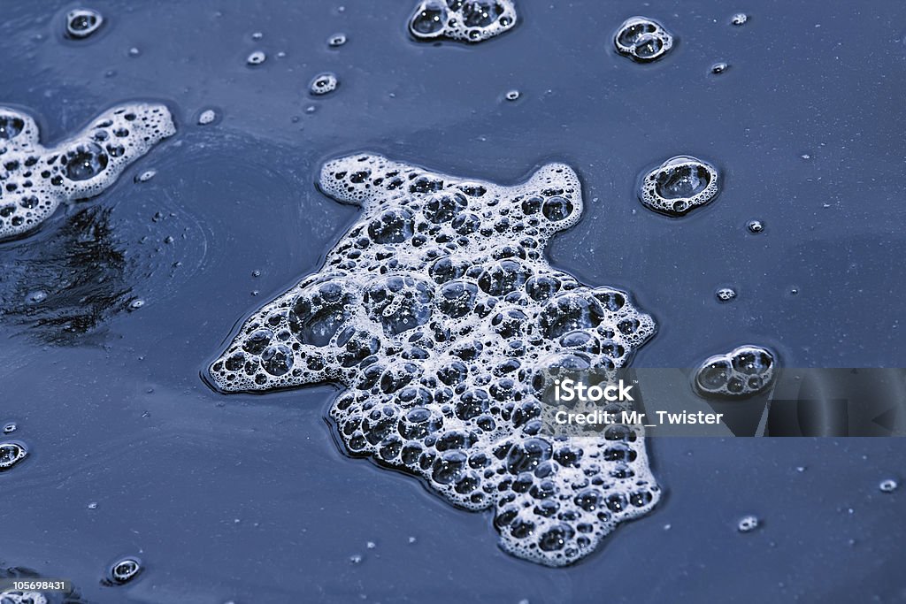 Water Pollution Untreated waste water pouring into a stream Bacterium Stock Photo