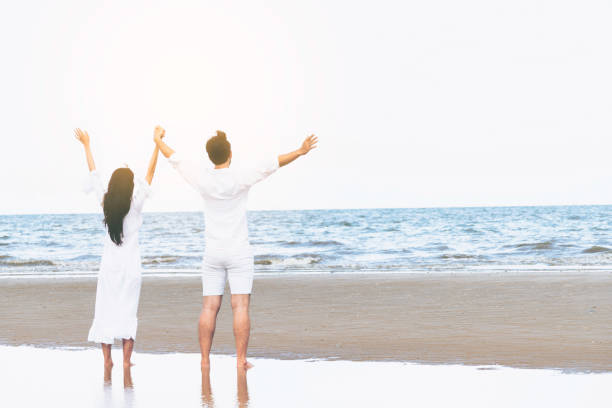 istock Couple going honeymoon on tropical beach in summer 1056985210