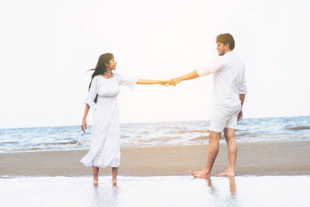 istock Couple going honeymoon on tropical beach in summer 1056985226