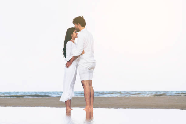 istock Couple going honeymoon on tropical beach in summer 1056985372