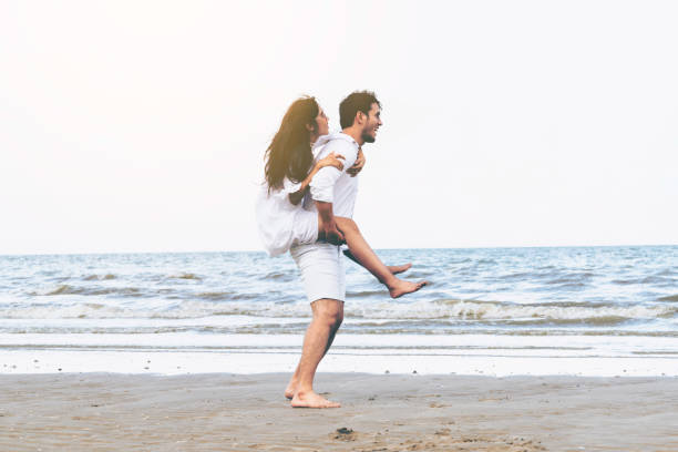 istock Couple going honeymoon on tropical beach in summer 1056985418