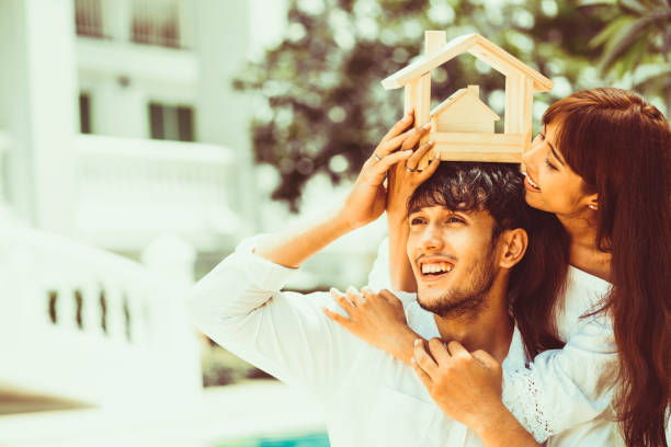 istock Young couple planning to buy a house concept. 1056987612