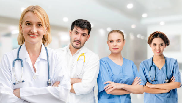 istock Doctor working in hospital with other doctors. 1056993558