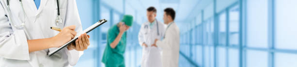 istock Doctor working in hospital with other doctors. 1056993834