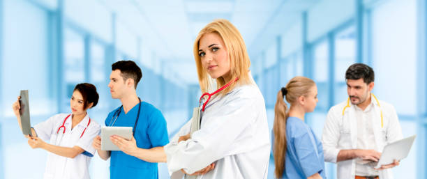 istock Doctor working in hospital with other doctors. 1056993850