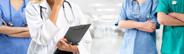 istock Doctor working in hospital with other doctors. 1056994496