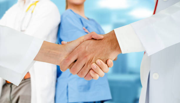 istock Doctor working in hospital with other doctors. 1056995778