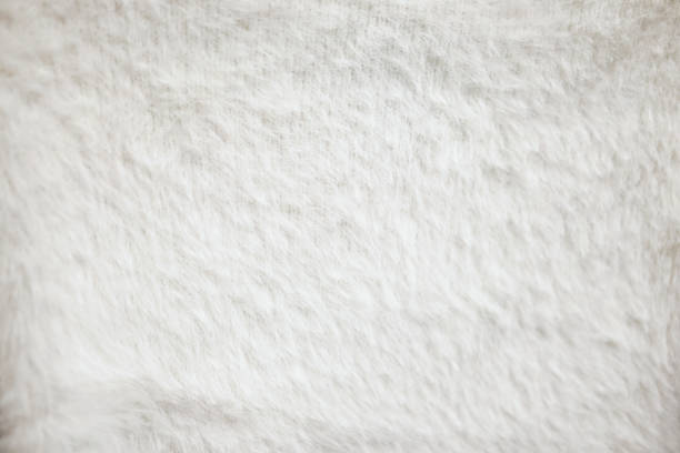 istock Close up furry white cloth texture. 1056997484