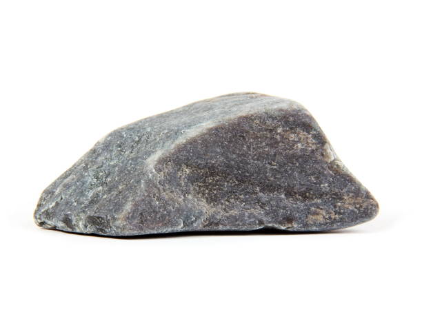Close-Up Of Rock Against White Background  rock object stock pictures, royalty-free photos & images