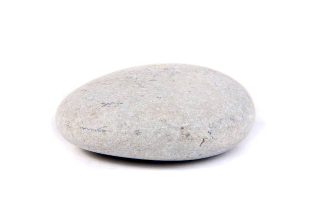 istock Close-Up Of Pebble Against White Background 1056999932