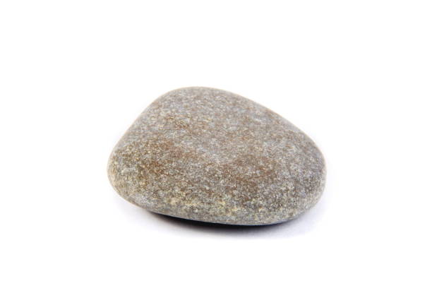 istock Close-Up Of Pebble Against White Background 1056999940