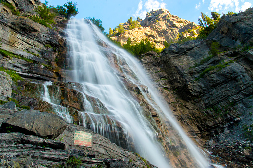 Here is a view of the very popular Bridal Veil Falls waterfall, which is located in Provo Canyon, Utah.  This shot is of the upper falls accessible by a reasonable hike.  The sign visible at the bottom of the picture gives a warning about going any farther up the falls.